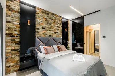 Łóżko lub łóżka w pokoju w obiekcie ZLOTA Luxury Apartments
