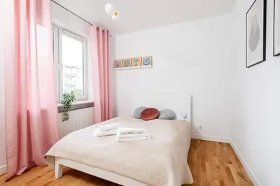 Łóżko lub łóżka w pokoju w obiekcie Superb Czerska Family Apartment With Parking
