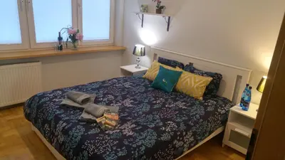 Łóżko lub łóżka w pokoju w obiekcie Rent0nline Hoża Apartment Center Metro