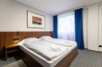 Łóżko lub łóżka w pokoju w obiekcie Noclegi Hit Rooms & Apartments
