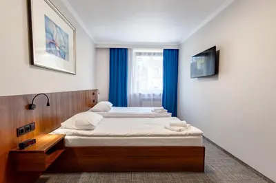 Łóżko lub łóżka w pokoju w obiekcie Noclegi Hit Rooms & Apartments