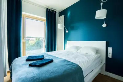 Łóżko lub łóżka w pokoju w obiekcie VipWarsawApartments Amber Mennica Residence