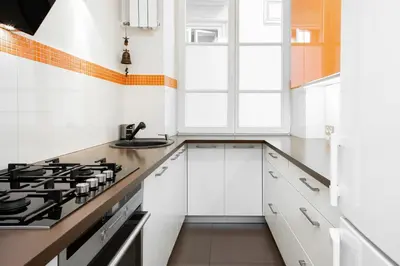 Kuchnia lub aneks kuchenny w obiekcie Apartments Warsaw Świętojańska by Noclegi Renters