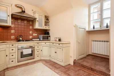 Kuchnia lub aneks kuchenny w obiekcie Apartments Warsaw Świętojańska by Noclegi Renters