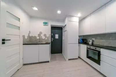 Kuchnia lub aneks kuchenny w obiekcie Warsaw Concierge Silver Apartment