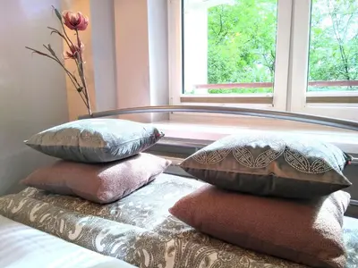 Łóżko lub łóżka w pokoju w obiekcie Chill & Explore by Cooee Apartments