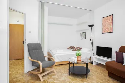 Telewizja i/lub zestaw kina domowego w obiekcie Apartments Warsaw Kakowskiego by Noclegi Renters