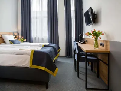Łóżko lub łóżka w pokoju w obiekcie Hotel Mokotów