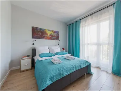 Łóżko lub łóżka w pokoju w obiekcie Okecie Airport Studio Bakalarska 2 P&O Serviced Apartments
