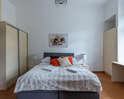 Łóżko lub łóżka w pokoju w obiekcie Novis Apartments Krakowskie Przedmieście