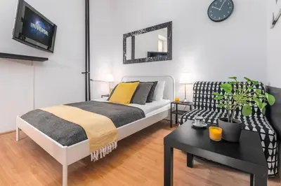 Łóżko lub łóżka w pokoju w obiekcie Apartments Wilcza 55 by Noclegi Renters