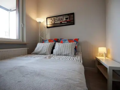 Łóżko lub łóżka w pokoju w obiekcie Airport Residence Blue