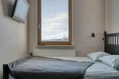 Łóżko lub łóżka w pokoju w obiekcie Airport Residence Amber