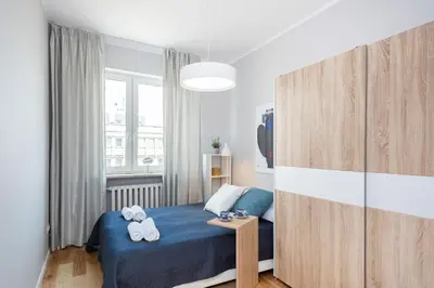 Łóżko lub łóżka w pokoju w obiekcie Apartments City Center by Noclegi Renters