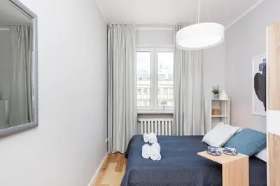 Łóżko lub łóżka w pokoju w obiekcie Apartments City Center by Noclegi Renters
