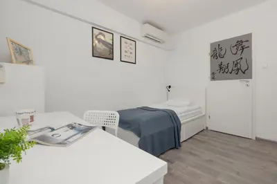 Łóżko lub łóżka w pokoju w obiekcie Apartments City Center by Noclegi Renters
