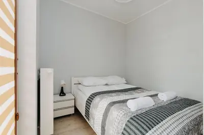 Łóżko lub łóżka w pokoju w obiekcie ShortStayPoland Zdziechowskiego (B72)