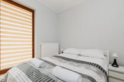 Łóżko lub łóżka w pokoju w obiekcie ShortStayPoland Zdziechowskiego (B72)