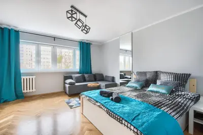 Łóżko lub łóżka w pokoju w obiekcie Apartament Centrum-Solidarnosci