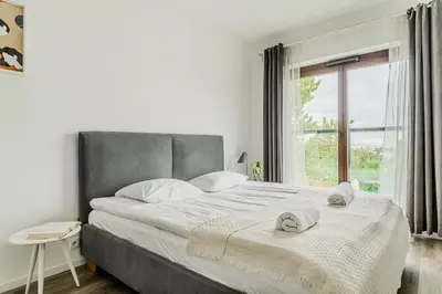 Łóżko lub łóżka w pokoju w obiekcie ShortStayPoland Naruszewicza (B77)