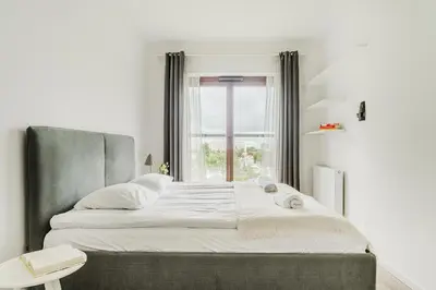Łóżko lub łóżka w pokoju w obiekcie ShortStayPoland Naruszewicza (B77)