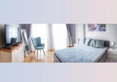 Łóżko lub łóżka w pokoju w obiekcie AMN APARTMENTS