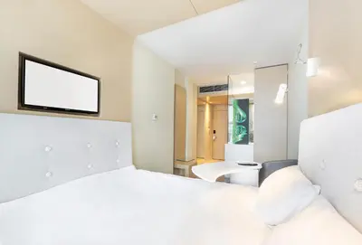 Łóżko lub łóżka w pokoju w obiekcie Sound Garden Hotel Airport