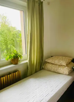 Łóżko lub łóżka w pokoju w obiekcie Hostel Tolek