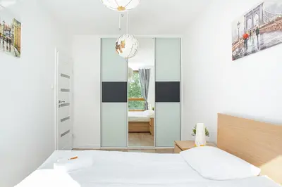 Łóżko lub łóżka w pokoju w obiekcie Apartment Warsaw Business Center by Noclegi Renters