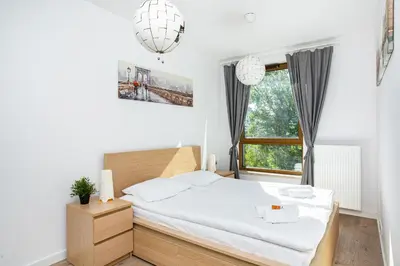 Łóżko lub łóżka w pokoju w obiekcie Apartment Warsaw Business Center by Noclegi Renters