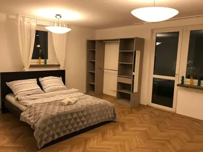 Łóżko lub łóżka w pokoju w obiekcie Anita Apartament Nowowiejska