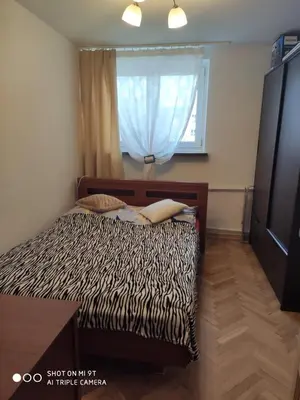Łóżko lub łóżka w pokoju w obiekcie Anita Apartament Nowowiejska