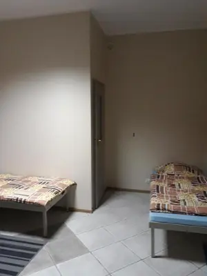 Łóżko lub łóżka w pokoju w obiekcie Noclegi Pod Kasztanami