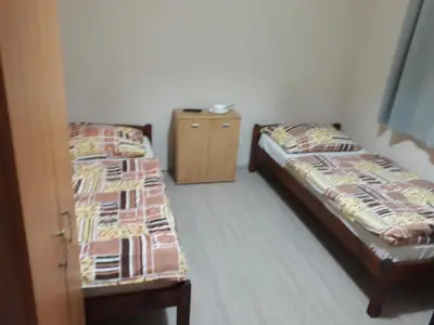 Łóżko lub łóżka w pokoju w obiekcie Noclegi Pod Kasztanami