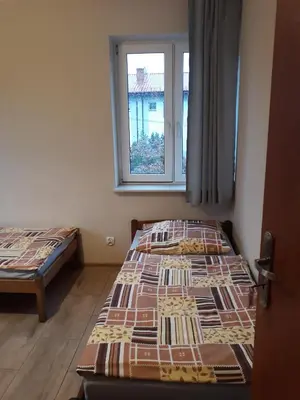 Łóżko lub łóżka w pokoju w obiekcie Noclegi Pod Kasztanami