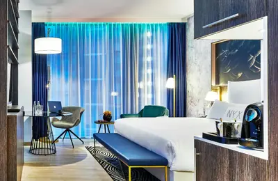 Łóżko lub łóżka w pokoju w obiekcie NYX Hotel Warsaw by Leonardo Hotels