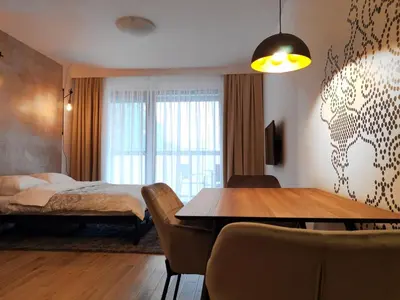 Łóżko lub łóżka w pokoju w obiekcie Come&Stay apartments Wola