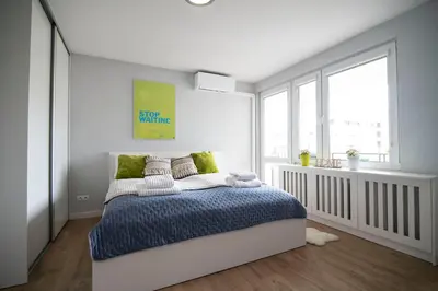 Łóżko lub łóżka w pokoju w obiekcie WLR Apartments - Hoza II