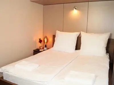Łóżko lub łóżka w pokoju w obiekcie Alma Apartments Rondo ONZ