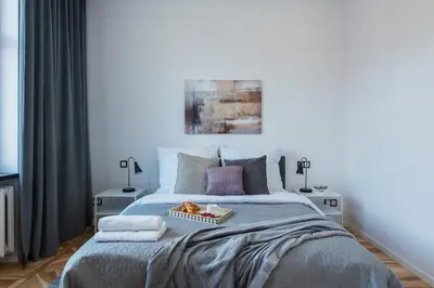 Łóżko lub łóżka w pokoju w obiekcie Marszalkowska Center Serviced Apartments