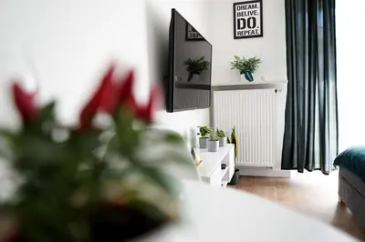 Łóżko lub łóżka w pokoju w obiekcie Vizzit Us Premium Apartments