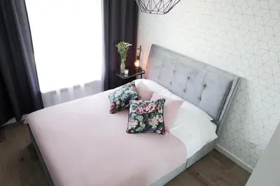 Łóżko lub łóżka w pokoju w obiekcie Vizzit Us Premium Apartments