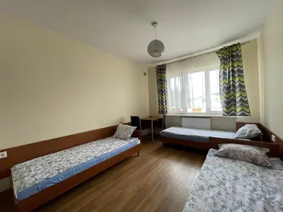 Łóżko lub łóżka w pokoju w obiekcie ANNA NOCLEGI