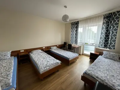 Łóżko lub łóżka w pokoju w obiekcie ANNA NOCLEGI