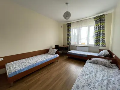 Łóżko lub łóżka w pokoju w obiekcie ANNA NOCLEGI