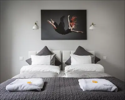 Łóżko lub łóżka w pokoju w obiekcie P&O Serviced Apartments NOWOGRODZKA