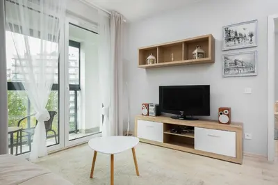 Telewizja i/lub zestaw kina domowego w obiekcie Apartments Warsaw Obozowa by Noclegi Renters
