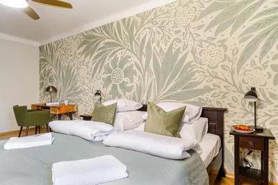 Łóżko lub łóżka w pokoju w obiekcie Miodowa Street P&O Serviced Apartments M3