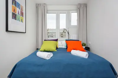 Łóżko lub łóżka w pokoju w obiekcie Warsaw City Center Świętokrzyska & Emilii Plater by Noclegi Renters