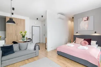 Łóżko lub łóżka w pokoju w obiekcie Sławińska 6 with Balcony by Noclegi Renters